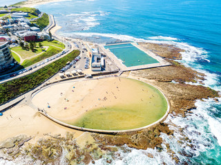 An aerial view of Newcastle beach and the ocean baths in New South Wales, Australia