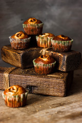Homemade Muffins on a dark wooden table in rustic style