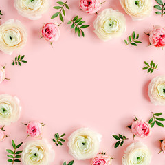 Obraz na płótnie Canvas Floral background frame made of pink ranunculus and roses flower buds on pink background. Flat lay, top view floral background.