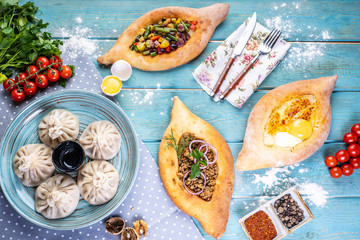 Georgian cuisine foodset from khachapuri, khinkali, top view.