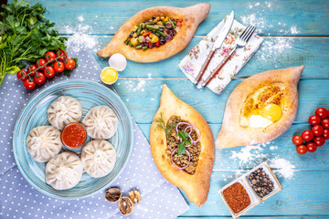 Georgian cuisine foodset from khachapuri, khinkali, top view.