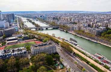 Fototapeta premium Aerial view of Paris city and Seine river from Eiffel Tower. France. April 2019