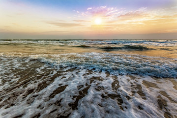 Sunset at beach colorful cloudy