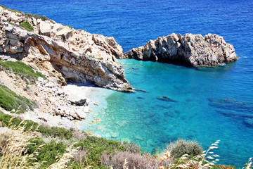 island of Greece. The island of Ikaria in the Aegean sea. Turquoise, blue sea. Rocky shore. Tourism and travel around the world.