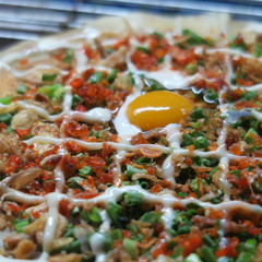 rice pizza, a popular snack in vietnam, asia's budget food on many markets, especially at night