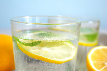 Cold refreshing lemonade with fresh mint and lemon in a glass Summer drink