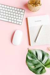 Flat lay home office desk. Female workspace with computer,  tropical palm leaves  Monstera,...