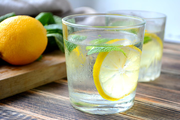 Cold refreshing lemonade with fresh mint and lemon in a glass Summer drink