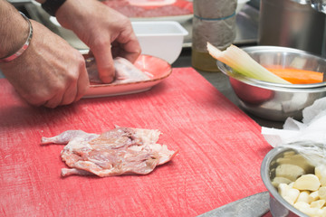 The chef cuts the duckling