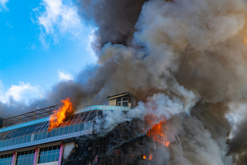 Burning building in thick smoke