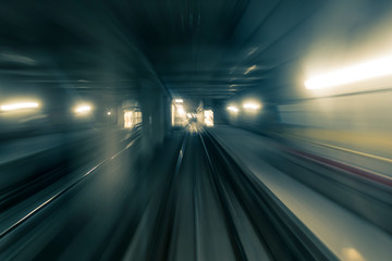 Fototapeta na wymiar Motion blurred shot taken from a front car train running inside a tunnel