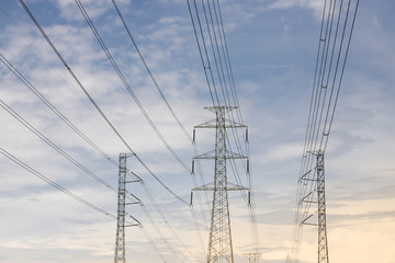 electric pillars with blue sky in evening time.