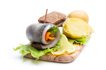 Marinated herring rolls with vegetables