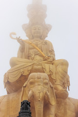 The giant Buddha in the white mist, the clear statuette, the huge contrast, the virtual versus the real, the buddhist statue