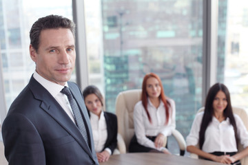 Portrait of business man and team