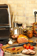 Grill steak on an electric stove. Pork neck fried on small electric grill. Home cooking. Healthy barbecue. Catering to friends. Electric grilling.