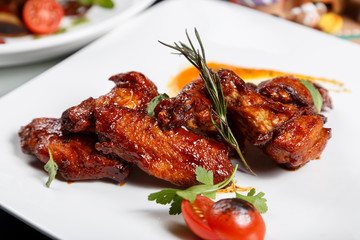 Food on white plate. Grilled meat.