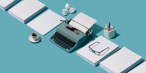 Vintage typewriter header and blank sheets