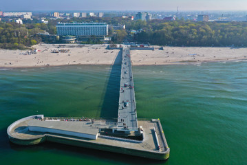 Aerial view on Kolobrzeg city, area of pier and beach at baltic sea shore