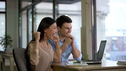 Happy man and business woman reading laptop email in office, work promotion