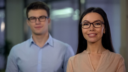 Fototapeta premium Confident professional office workers smiling on camera, business company team