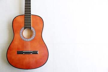 Obraz premium half acoustic guitar on white background with right free space