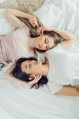 young lovely beautiful couple lying in a bed, sleeping, night sleep, reting time, free time