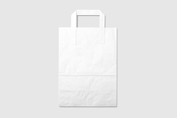 Mockup of a blank white paper shopping bag with handles on light grey background. High resolution.