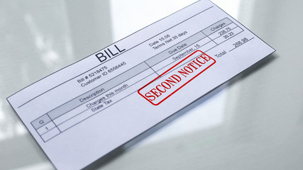 Fototapeta premium Second notice seal stamped on bill, payment for services, month expenses tariff