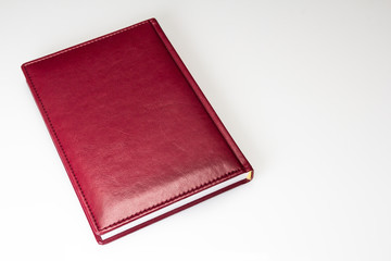 red leather book on white background