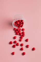 jar with hearts. love care. treatment for lovers. top view photo. love is the best treatment . love and other drugs
