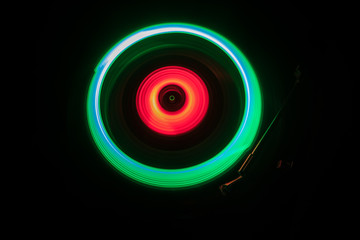 Concept of speed - Trail of fire and smoke - Vinyl record. Burning vinyl disk. Turntable vinyl record player. Retro audio equipment for disc jockey. Sound technology