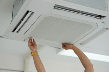 Cassette Air Conditioners Technician try to open ,close air cover 