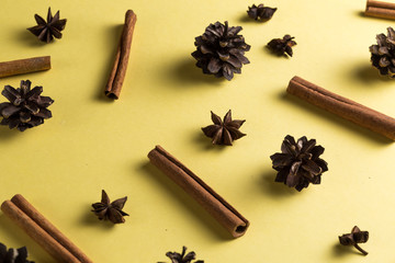 stars anise, corns, cinnamons in the cocktail recipe, op view photo. set of ingredients in a chaotic manner