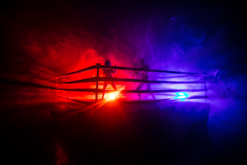 Man and woman boxing on the ring. Sport concept. Artwork decoration with foggy toned dark...