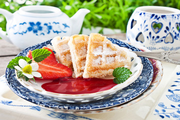 Wafers and strawberries with sauce