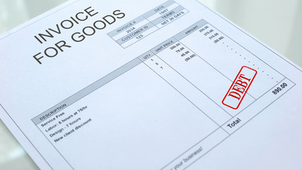Debt seal stamped on invoice for goods document, business payment, crediting