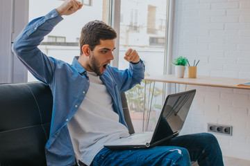young man caught watching the laptop