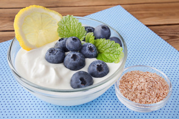 Yoghurt and blueberries with wheat bran