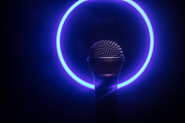 Microphone karaoke, concert . Vocal audio mic in low light with blurred background. Live music, audio equipment. Karaoke concert, sing sound. Singer in karaokes, microphones. - obrazy, fototapety, plakaty