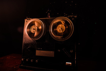 Fototapeta Special agent intelligence officer listens to conversations and records on a reel to reel tape recorder 3 obraz