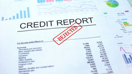 Credit report rejected, seal stamped on official document, business project