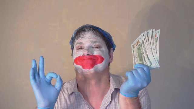 excerpt from the short speech of the funny actor men mime.actor performs with a stack of hundred dollar bills.pantomime.