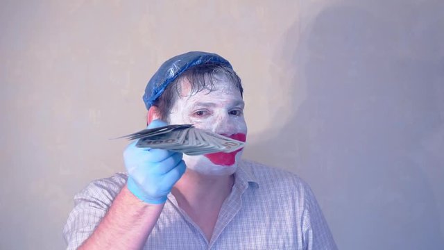 excerpt from the short speech of the funny actor men mime.actor performs with a stack of hundred dollar bills.pantomime.