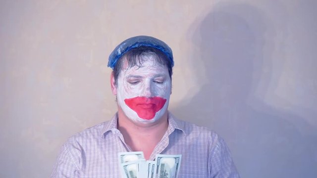excerpt from the short speech of the funny actor men mime.actor performs with a stack of hundred dollar bills.pantomime.