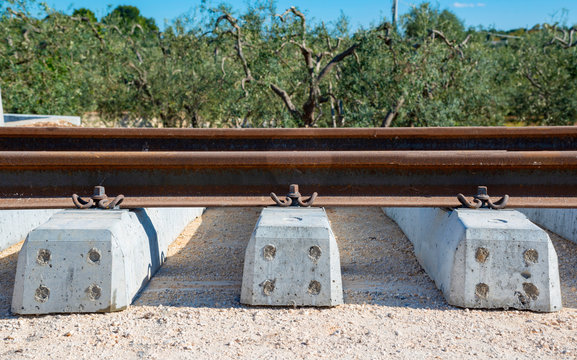 Rails, sleepers and mounting nuts close up