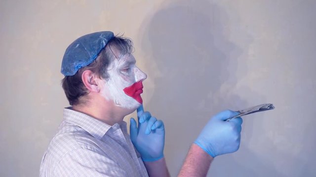 excerpt from the short speech of the funny actor men mime.actor performs with a stack of hundred dollar bills.pantomime.
