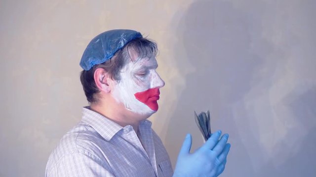 excerpt from the short speech of the funny actor men mime.actor performs with a stack of hundred dollar bills.pantomime.