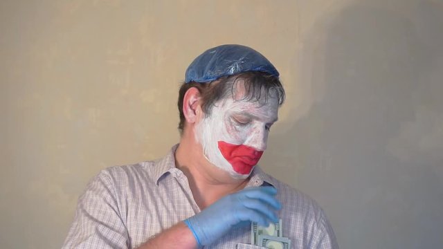 excerpt from the short speech of the funny actor men mime.actor performs with a stack of hundred dollar bills.pantomime.