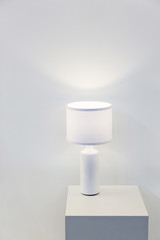 Beautiful modern home light on the table near the wall